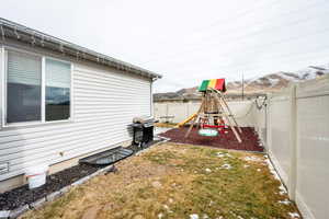 View of yard with a mountain view and a playground