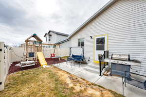 View of patio featuring a playground