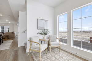 Sitting room with light hardwood / wood-style floors