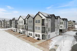 View of front of home featuring central air condition unit