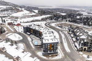 Snowy aerial view featuring a mountain view