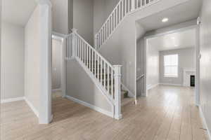 Stairs featuring hardwood / wood-style floors