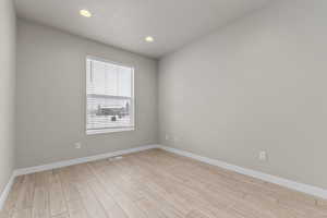 Unfurnished room featuring light hardwood / wood-style flooring