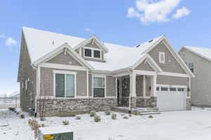 Craftsman-style house featuring a garage
