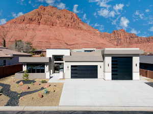 Contemporary home with a garage and a mountain view