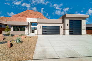 Modern home with a garage and a mountain view