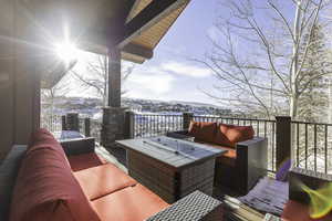 Snow covered deck featuring an outdoor hangout area