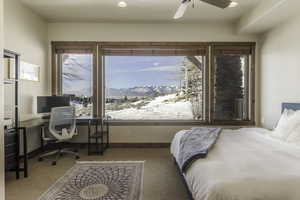 Bedroom featuring light carpet and ceiling fan