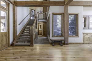 Foyer entrance with light wood-type flooring