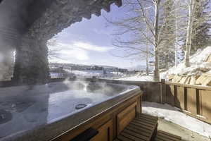 Exterior space featuring a hot tub