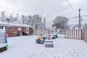 View of yard layered in snow