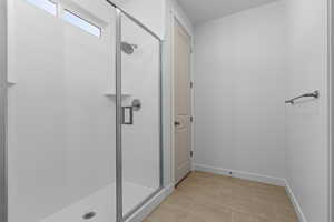 Bathroom with a shower with shower door