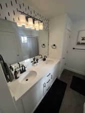 Bathroom with wood-type flooring and vanity