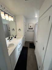 Bathroom featuring hardwood / wood-style flooring, vanity