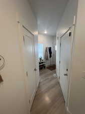 Hallway featuring light hardwood / wood-style flooring