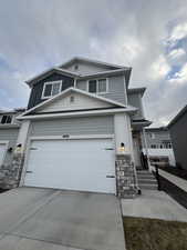 View of front of home featuring a garage