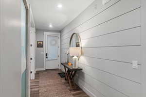 Doorway featuring dark hardwood / wood-style floors