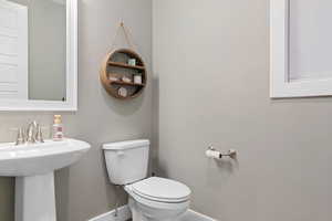 Bathroom featuring sink and toilet