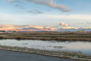 View of water feature with a mountain view