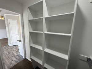 Interior space with baseboards and wood finished floors