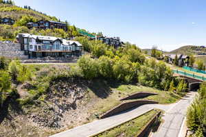 Aerial view of property and surrounding area with a mountainous background and a pool