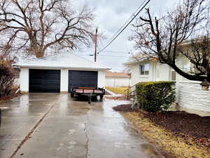 View of oversized 2 car garage with shop area