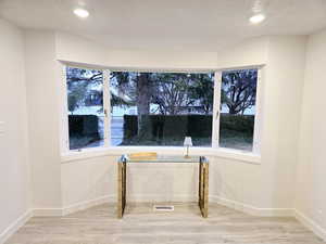 Large formal dining area with bay box windows
