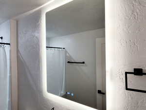Bathroom featuring a Smart mirror vanity