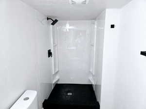 Bathroom with toilet and a shower