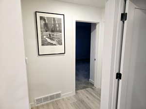 Corridor featuring light hardwood / wood-style floors