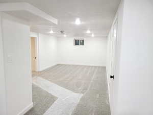 Great room  featuring light carpet and a large fireplace