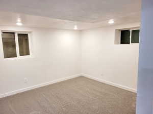 6th bedroom with a textured ceiling