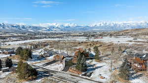 Snowy aerial view with a mountain view