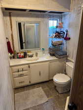 Bathroom featuring vanity and toilet