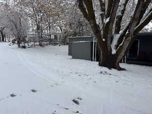 View of yard covered in snow