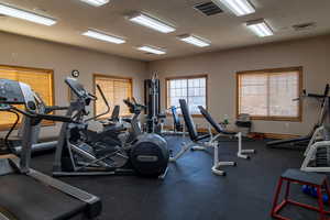 Exercise room with a textured ceiling