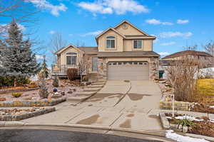 View of property with a garage