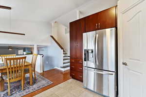 Kitchen with stainless steel fridge and ceiling fan