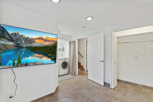 Clothes washing area featuring washer / dryer