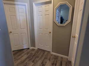 Doorway to outside with dark hardwood / wood-style floors