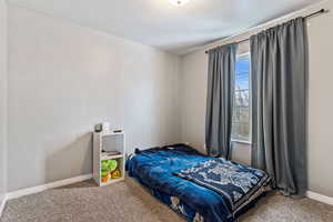 View of carpeted bedroom