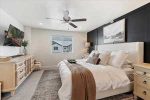 Carpeted bedroom with ceiling fan