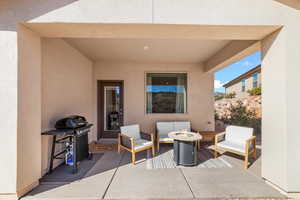 View of patio / terrace with a grill and an outdoor living space with a fire pit