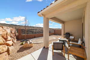 View of patio featuring an outdoor fire pit