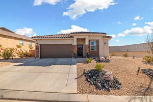 Mediterranean / spanish-style house featuring a garage