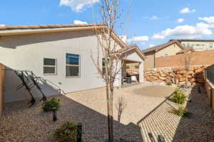 Back of property with a patio