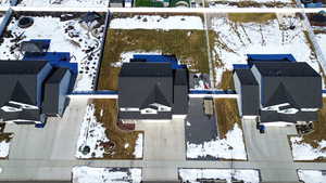 Snowy aerial view with a residential view