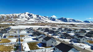 Property view of mountains with a residential view