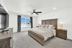 Bedroom featuring ceiling fan and light colored carpet