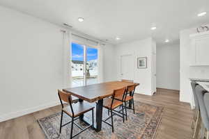 Dining space with light wood-type flooring